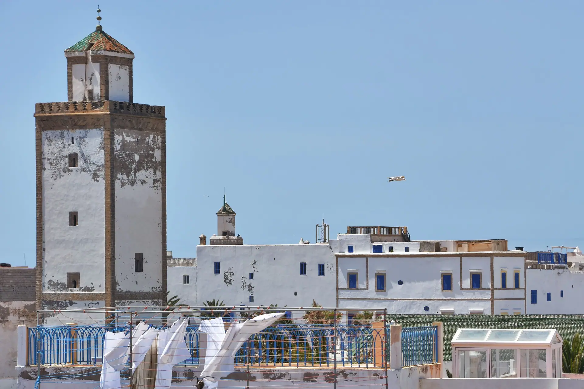 Scenic view of historic architecture and coastal fortress walls in Essaouira, Morocco.