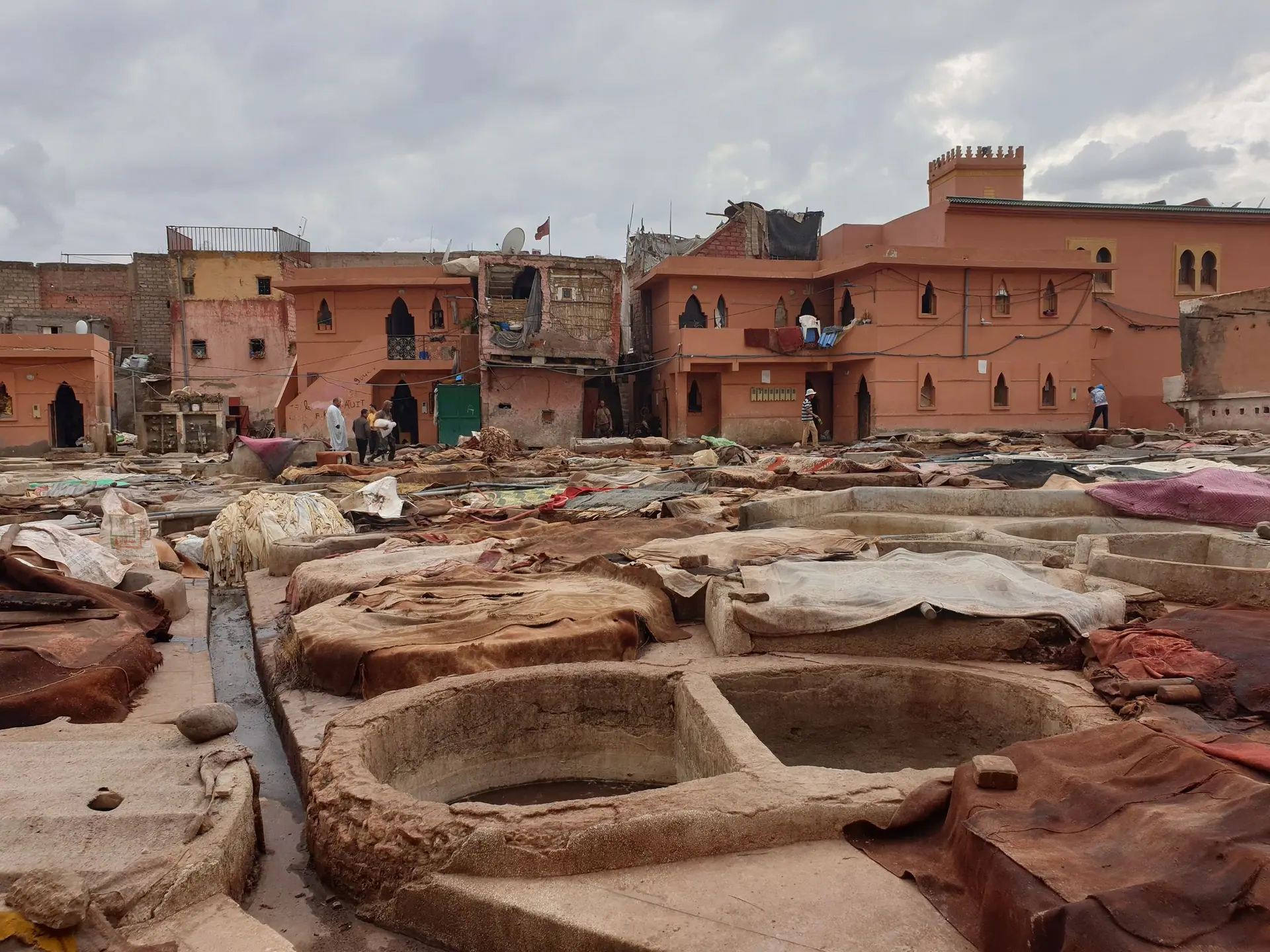 Explore a traditional tannery in Marrakech, Morocco, showcasing age-old leather production techniques.